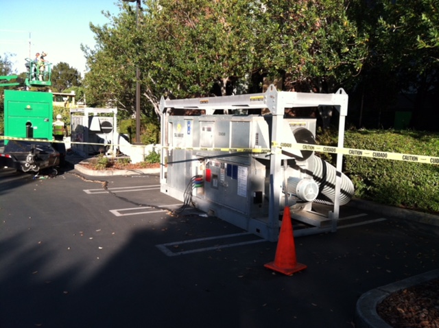 Desiccant dehumidifier (white machinery) outside